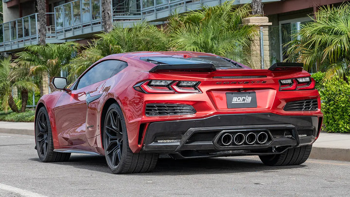 Rear of a red C8 Corvette fitted with the Borla 140957 cat-back exhaust, quad center exit tips in the rear fascia