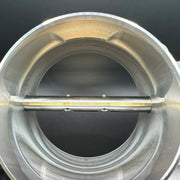 Close-up of a metallic valve with a dark background