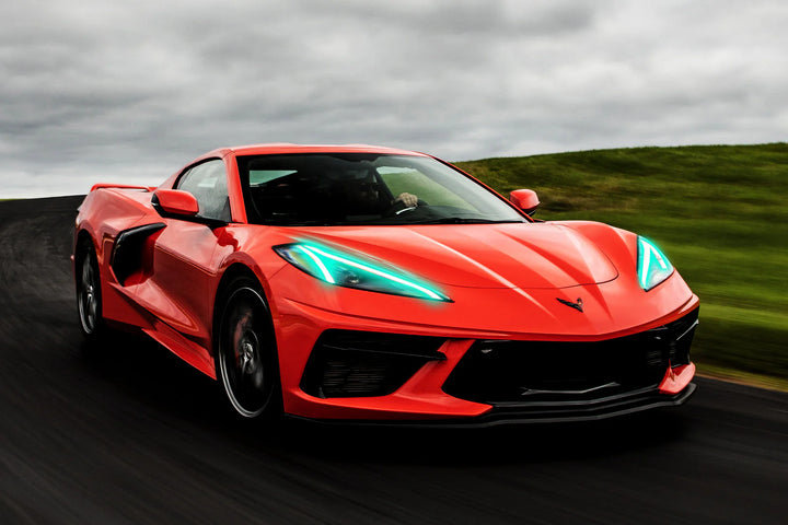 C8 Corvette Stingray with ORACLE ColorSHIFT RGB+A LED DRLs glowing vibrantly at dusk, showcasing custom colors