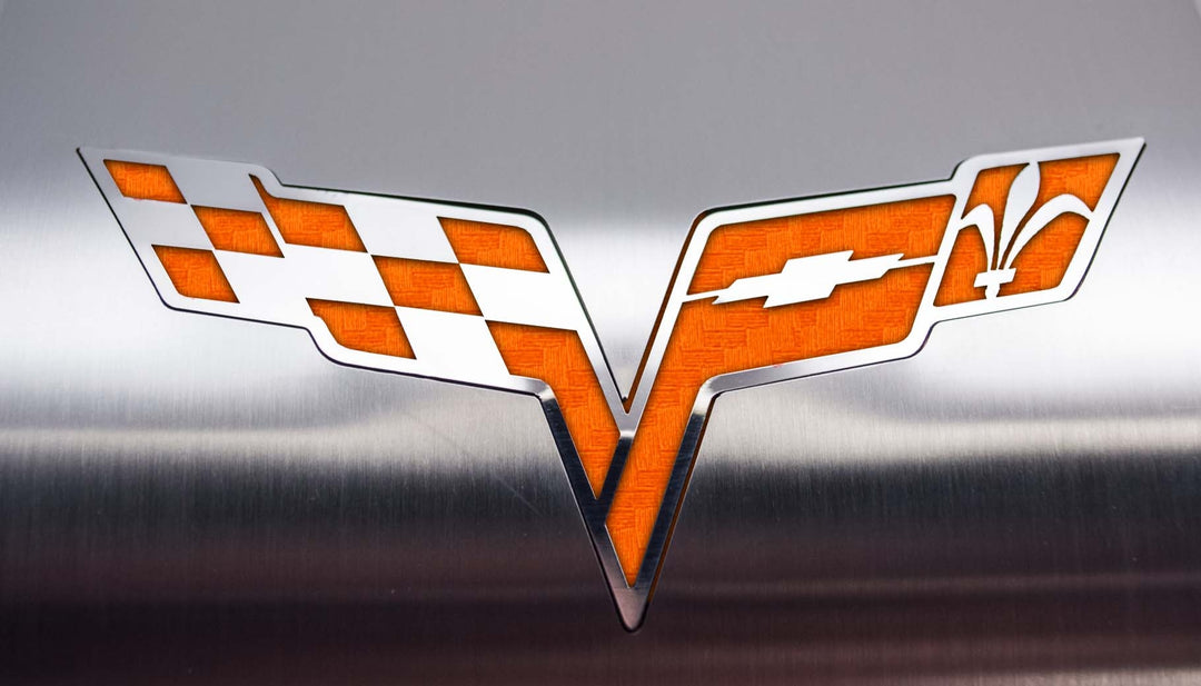 ACC 043122 Orange carbon-fiber-look vinyl inlay detail on C6 Corvette crossed-flags alternator cover