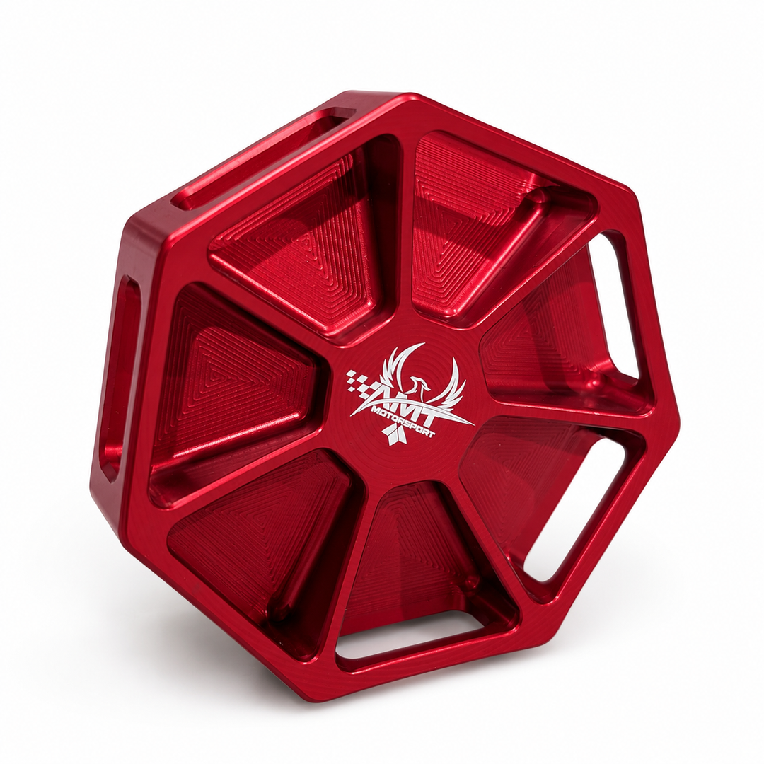 Red AMT Motorsport Overkill C8 Corvette oil cap showing seven-sided profile, machined pockets and engraved logo
