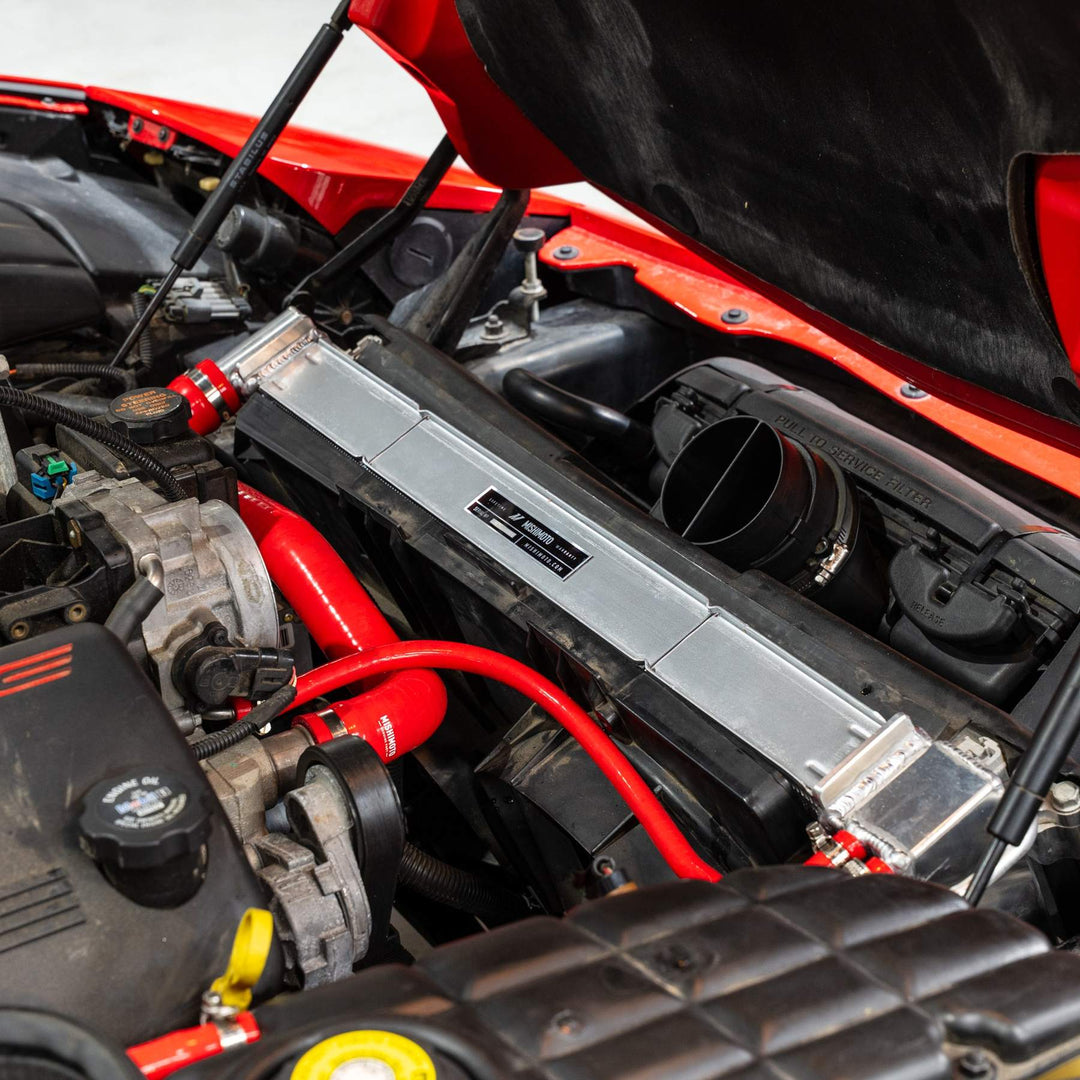Mishimoto MMRAD-C5-97 radiator installed in a C5 Corvette; red silicone hoses sold separately