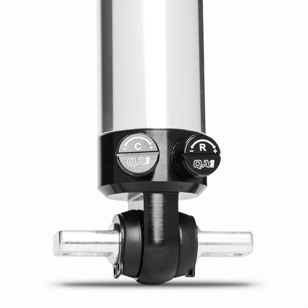 Close-up view of the QA1 Stocker-Star double-adjustable shock mounting eyelet and hardware for C5 Corvette suspension.
