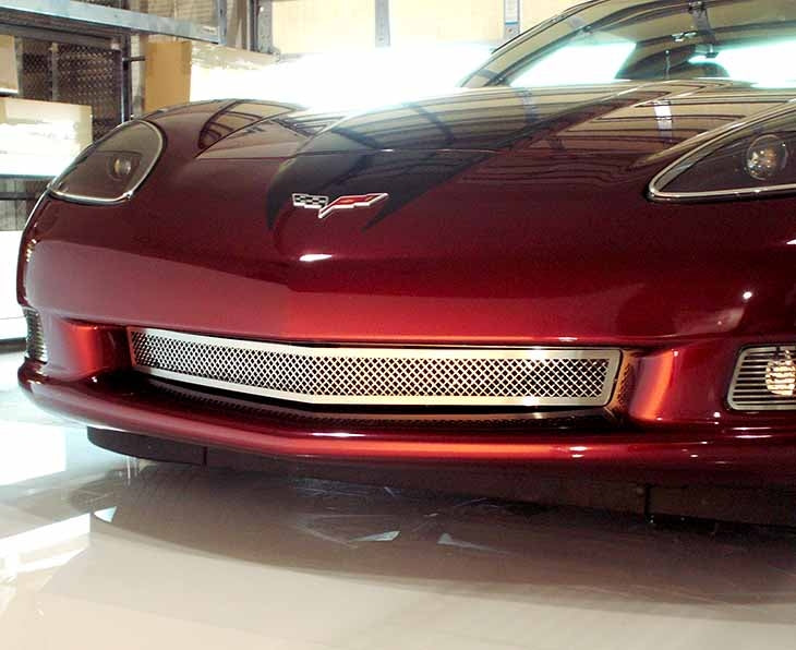 Polished American Car Craft 042041 front grille installed on a red C6 Corvette Base, front view