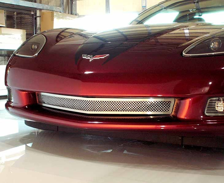 Polished American Car Craft 042041 front grille installed on a red C6 Corvette Base, front view