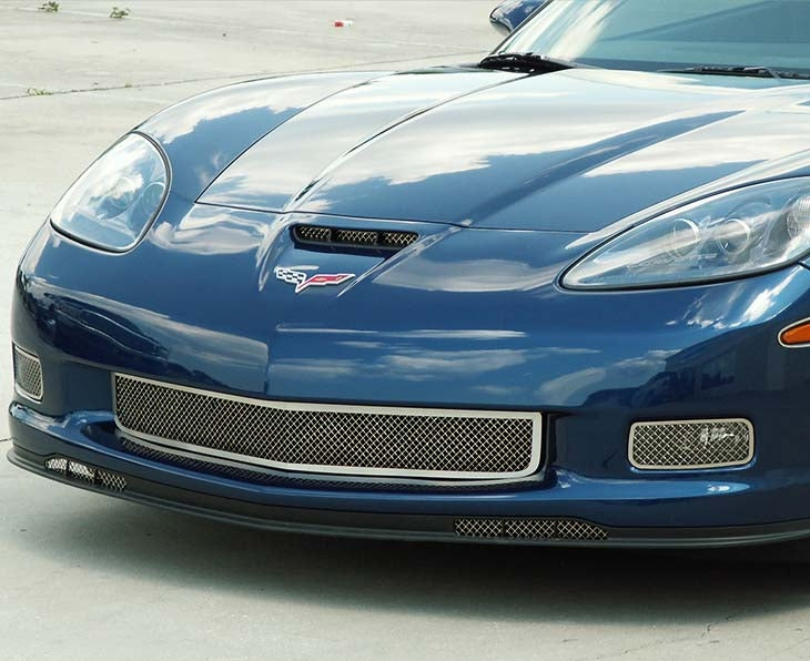 American Car Craft 042043 polished main front grille installed on a blue C6 Corvette; other grille accents are separate