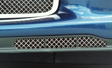 American Car Craft 042045 polished Laser Mesh grille installed in the opposite lower air-dam opening on a blue C6 Corvette