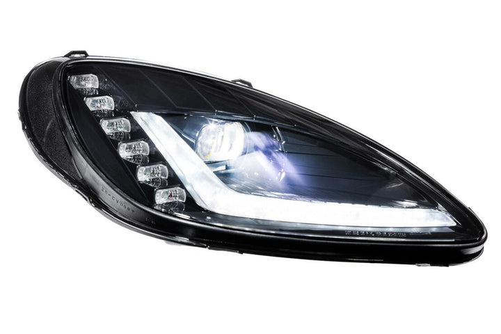 Morimoto XB Gen I C6 Corvette headlight with Bi-LED projector and white daytime running light illuminated