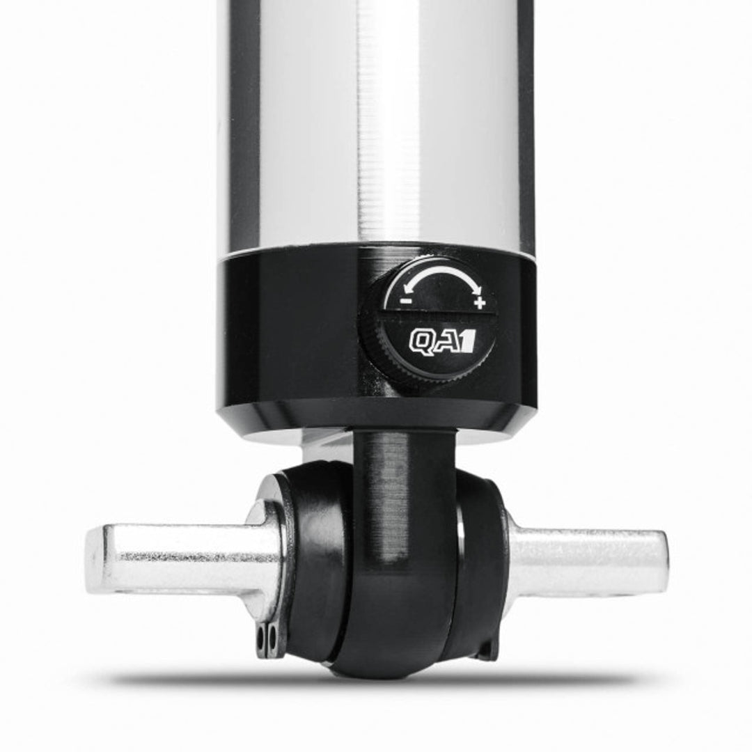 Close-up of QA1 Stocker-Star front shock mounting eyelet showing hardware connection point for C6 Corvette suspension.