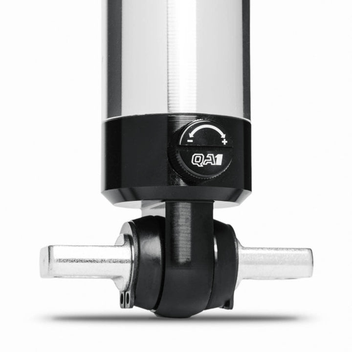 Close-up of QA1 Stocker-Star front shock mounting eyelet showing hardware connection point for C6 Corvette suspension.
