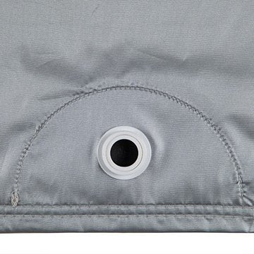 Close-up of a Covercraft Reflec’tect car-cover grommet and surrounding stitching