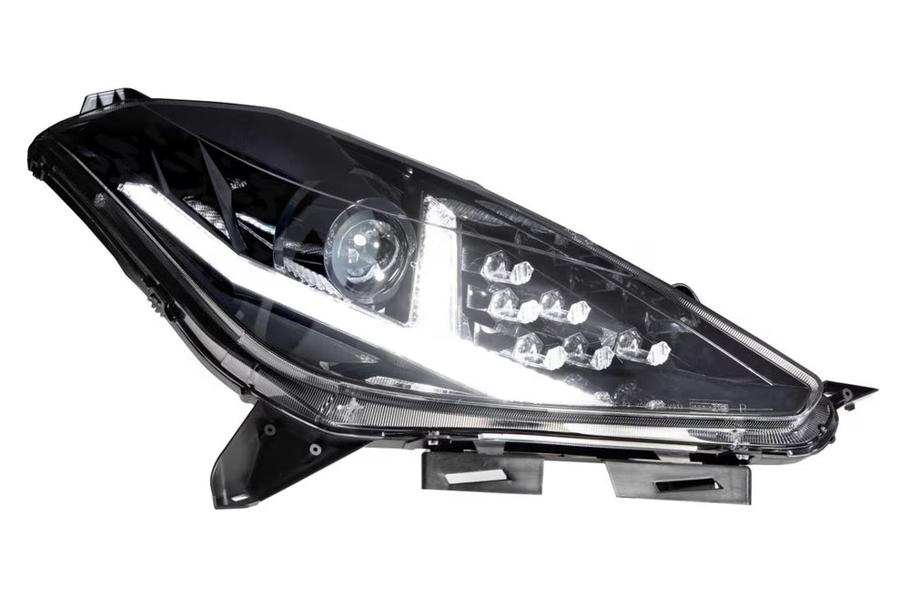 Single Morimoto LF463 C7 Corvette headlight with white LED daytime running light