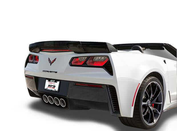 Rear three-quarter view showing quad center-exit ceramic black tips on Borla ATAK 11856CB for C7 Stingray with NPP
