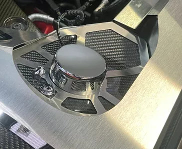 ACC 883042 carbon-fiber shock-tower insert with brushed stainless trim and a plain chrome cap in an early C8 Corvette Coupe