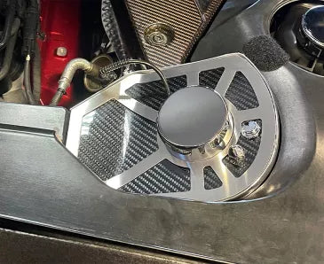 Opposite-side view of carbon-fiber shock-tower trim with a plain cap in a 2020–2022 C8 Corvette Coupe engine compartment