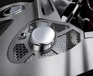 ACC 883053 perforated stainless shock-tower cover with a plain chrome cap installed in the engine bay of a later C8 Corvette Coupe