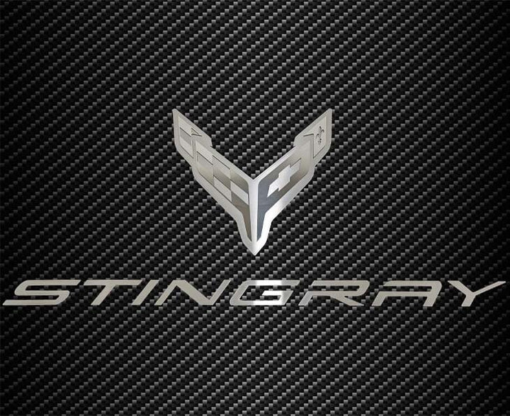 C8 Corvette crossed-flags and Stingray hood badge; carbon-pattern hood panel not included.