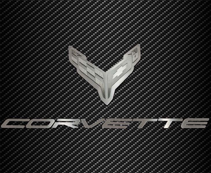 C8 Corvette crossed-flags and Corvette script hood badge; carbon-pattern hood panel not included.