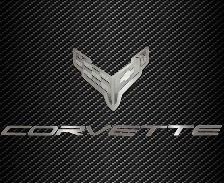 C8 Corvette crossed-flags and Corvette script hood badge; carbon-pattern hood panel not included.