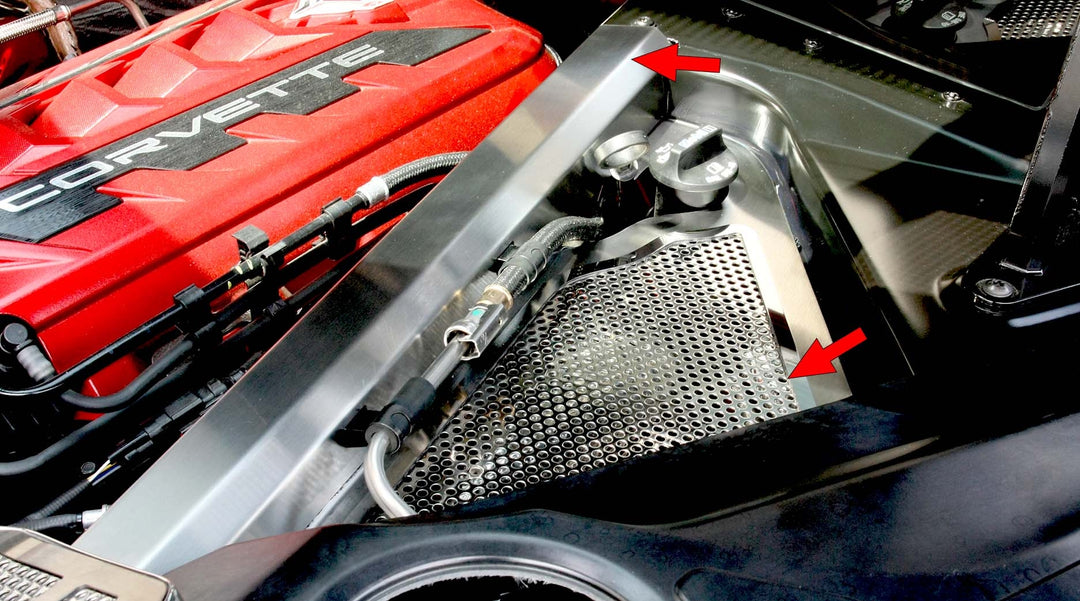 Opposite-side C8 Corvette header guard and brushed crossmember cover, with arrows identifying the installed parts