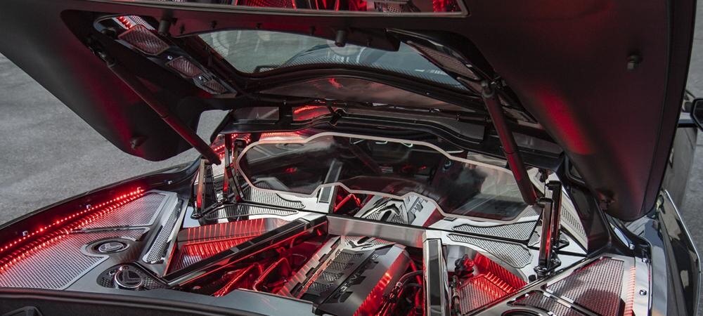 Angled view of the American Car Craft rear window frame in a C8 Corvette Coupe engine compartment