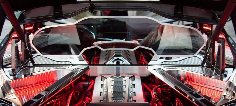 American Car Craft polished frame with brushed trim around the rear window of a C8 Corvette Coupe engine compartment