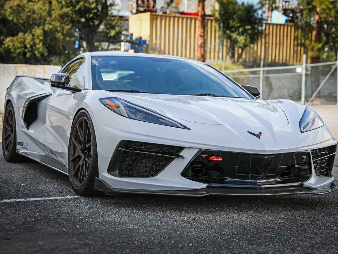 Red aFe CONTROL front tow hook installed on a C8 Corvette, part 450-401014-R