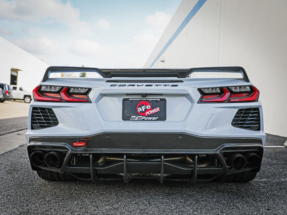 Red aFe CONTROL rear tow hook installed on a C8 Corvette, part 450-401015-R