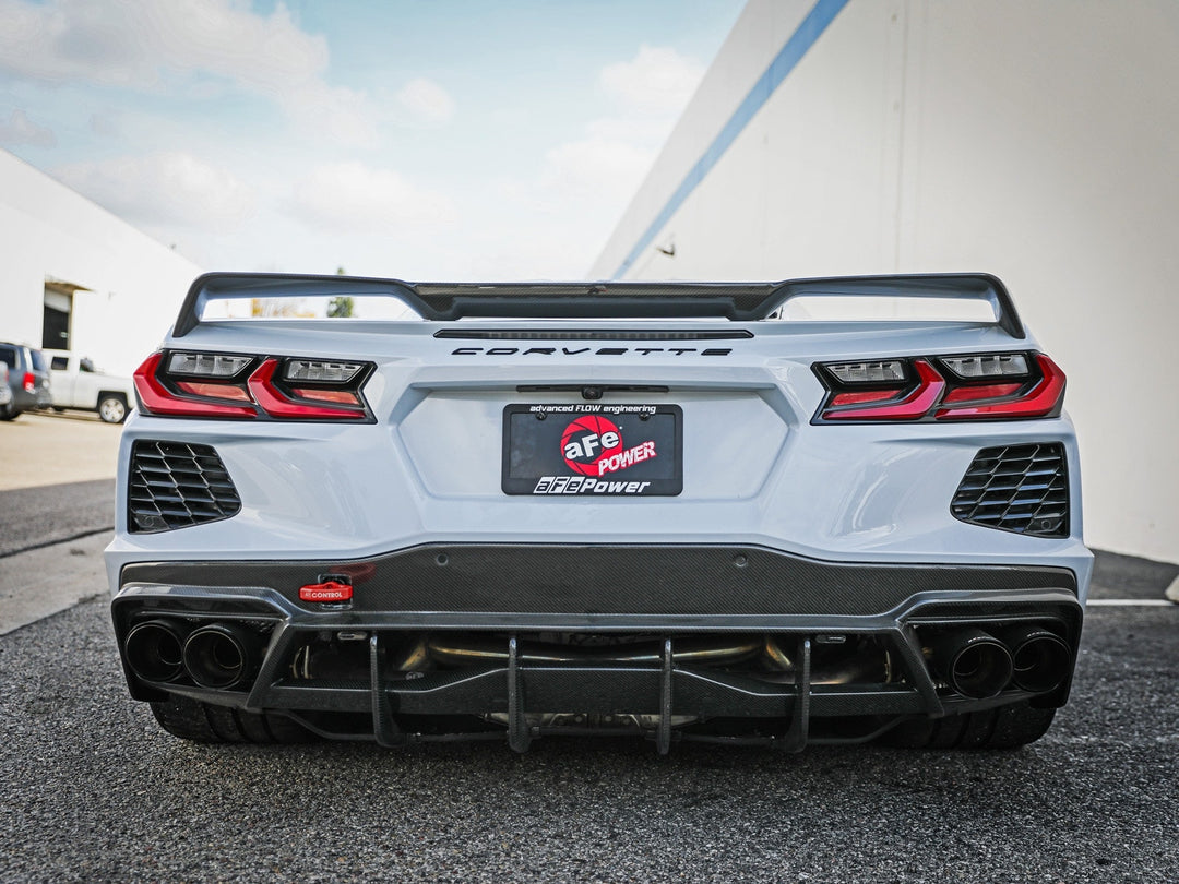 Red aFe CONTROL rear tow hook installed on a C8 Corvette, part 450-401015-R