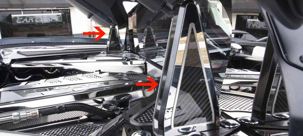Both C8 Corvette Coupe engine-hatch hinge areas shown with polished stainless and carbon-fiber dress-up trim and separate engine-bay accessories