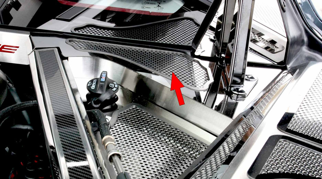 Perforated stainless C8 Corvette Coupe rear cowl trim shown from an angle, with arrows identifying the cover and lower edge