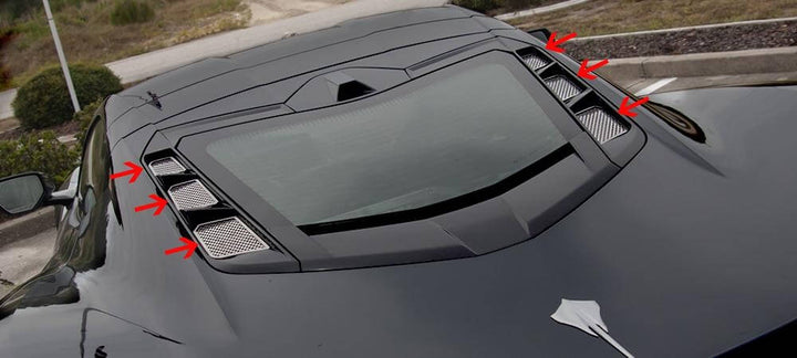 Six polished perforated rear hood vent inserts on a C8 Corvette Coupe, with arrows identifying all six installed pieces