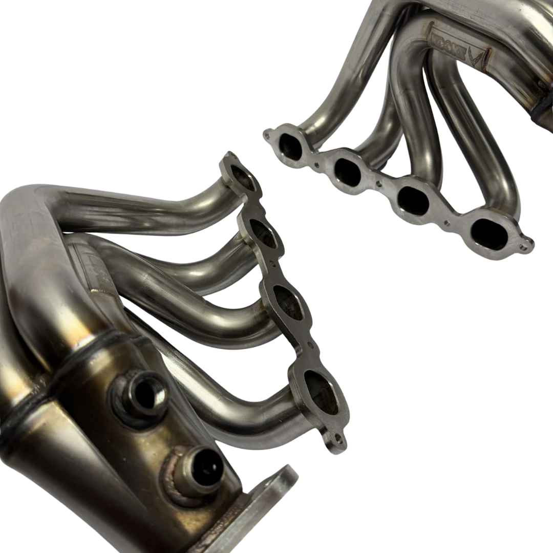 Oval port head flanges on a pair of Kooks C8 Corvette E-Ray long tube headers, stock bolt pattern visible