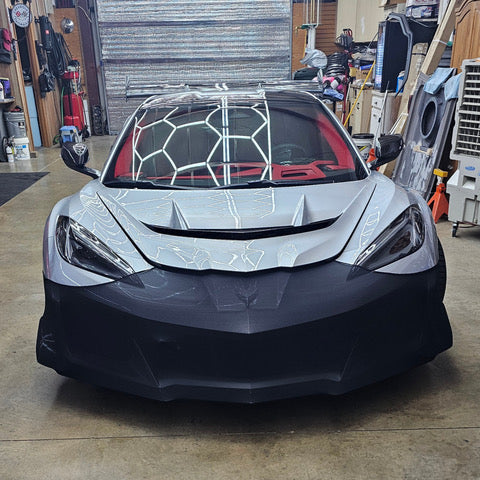NoviStretch FBM850V front bumper mask fitted across the lower front fascia and splitter of a widebody C8 Corvette