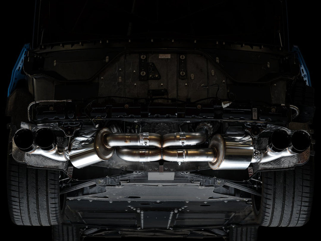 AWE 3015-43159 Touring exhaust with Diamond Black tips installed on a C8 Corvette, underbody view