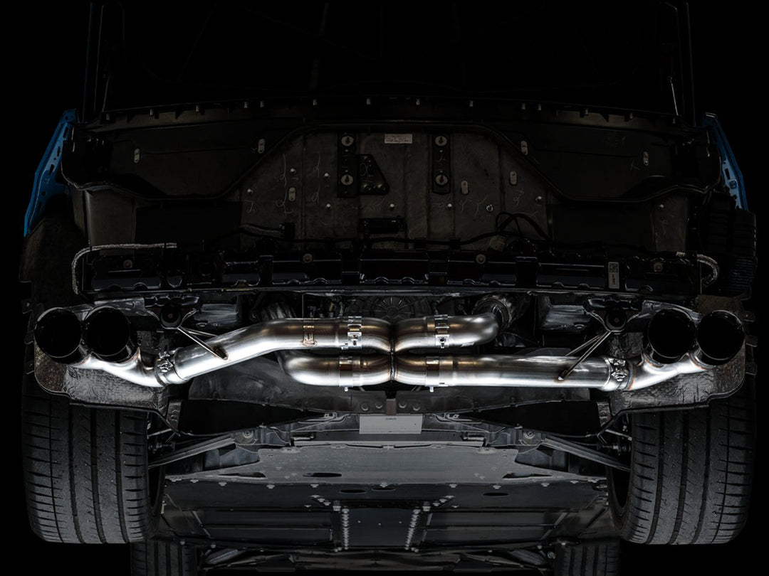 AWE 3020-43086 Track exhaust with Diamond Black tips installed on a C8 Corvette, underbody view