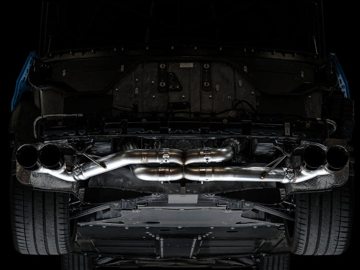 AWE 3020-43086 Track exhaust with Diamond Black tips installed on a C8 Corvette, underbody view