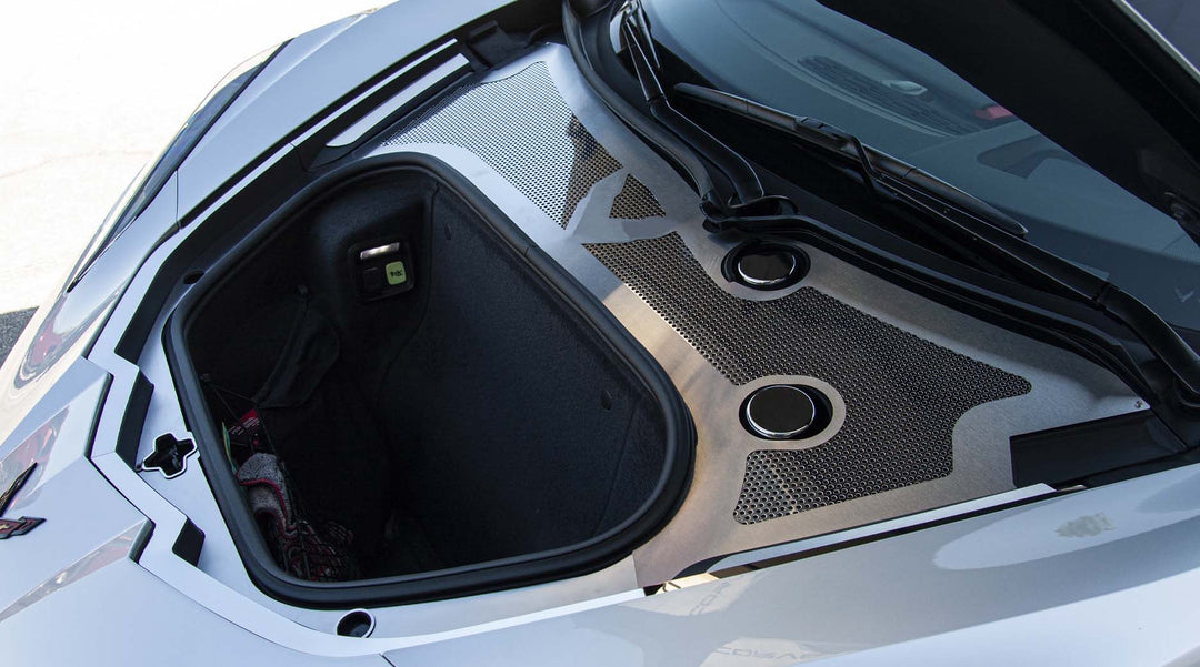 Wide installed view of ACC stainless front wiper-cowl trim on a white C8 Corvette, showing its position beneath the windshield