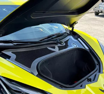 ACC brushed stainless and polished perforated front cowl trim installed behind the front trunk of a yellow C8 Corvette