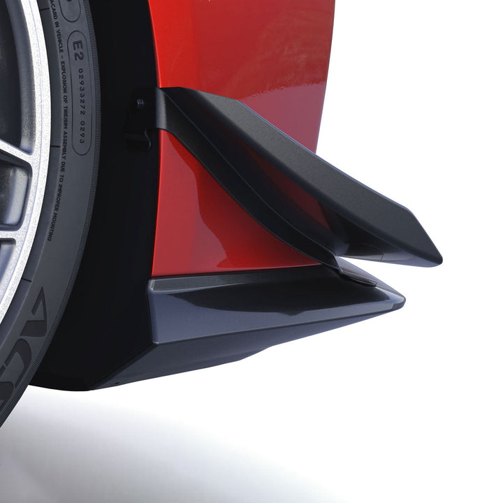 Close view of the ACS Composite canard blades stacked outboard of the splitter on a widebody C8 Corvette, beside the front tire