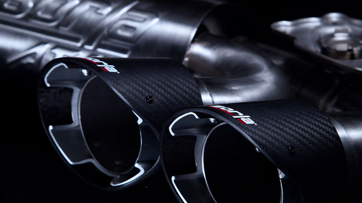Close-up of the four inch carbon fiber tip with a bright center on the Borla 140839CF ATAK cat-back for the 2027 C8 Corvette Grand Sport