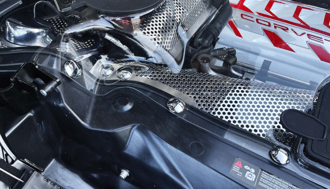 Chrome engine bolt covers shown close up along the perimeter of a C8 convertible engine bay