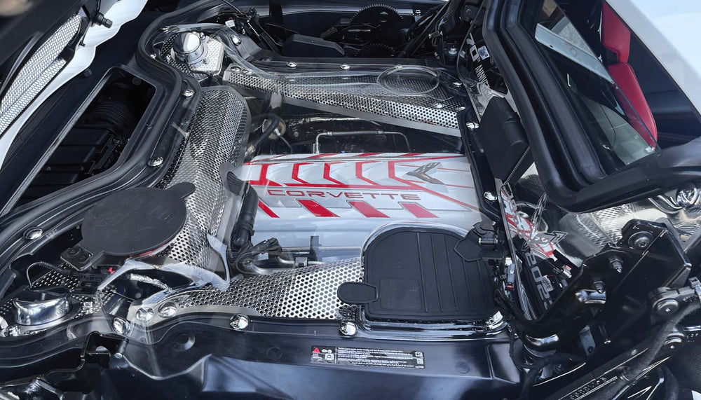 Engine bolt-cover kit installed around a C8 hardtop convertible engine bay