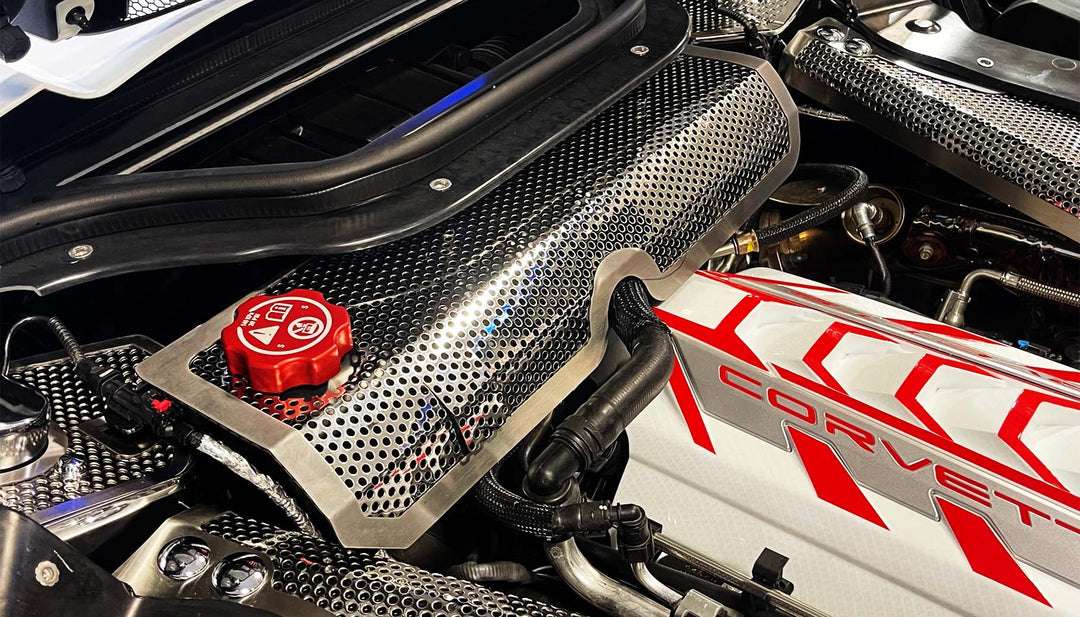 ACC perforated stainless water tank cover with brushed trim installed in a C8 hardtop convertible