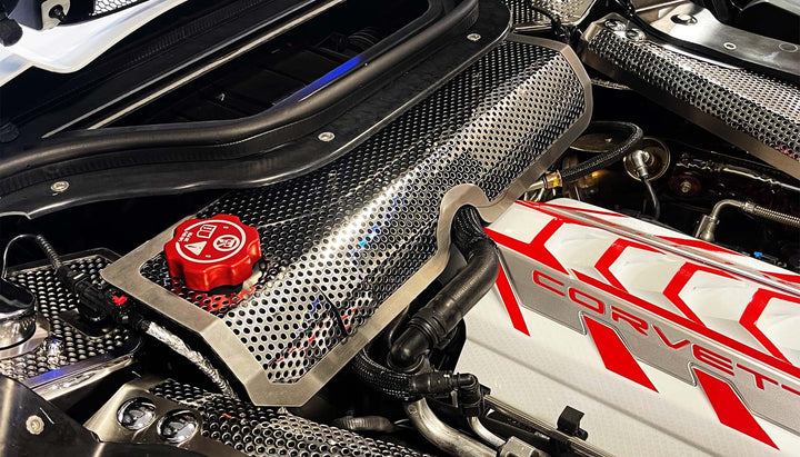 ACC perforated stainless water tank cover with brushed trim installed in a C8 hardtop convertible