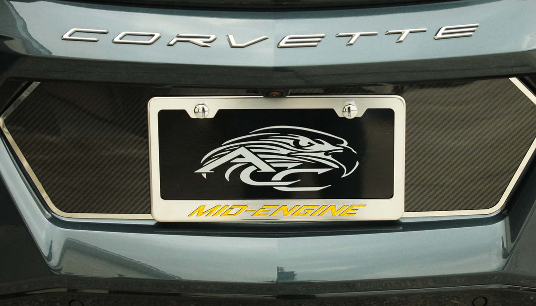 C8 Corvette MID-ENGINE license frame with yellow lettering and polished-base trim