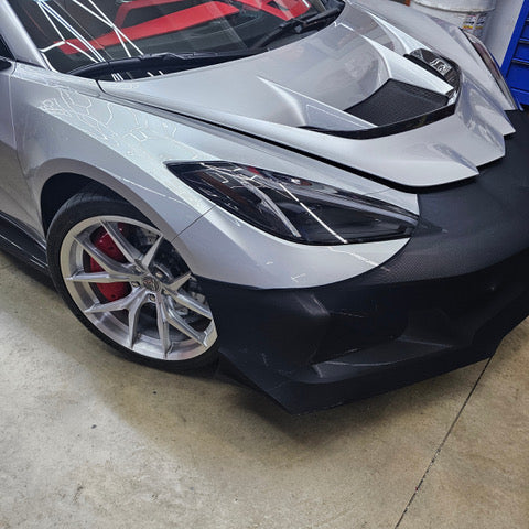 Front three quarter view of the NoviStretch FBM850V mask on a C8 Corvette ZR1 with the ZTK Performance Package dive plane and front splitter