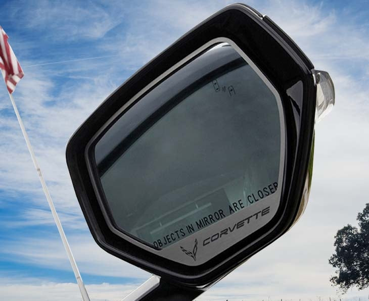 CORVETTE-design brushed stainless trim framing the mirror glass on a C8 Corvette