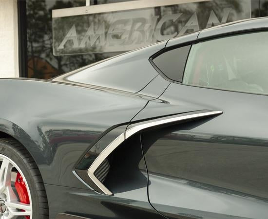 Brushed stainless side vent trim with chrome molding installed on one side of a C8 Corvette; the kit includes trim for both sides