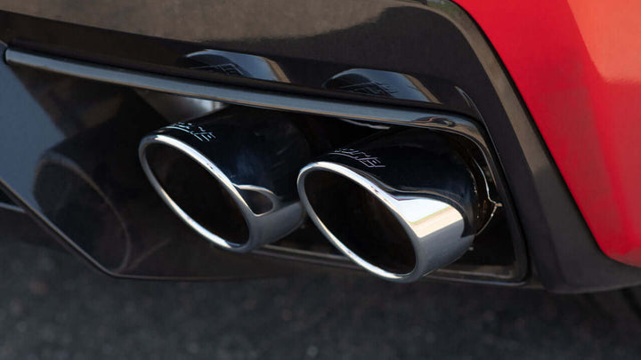 Close-up of Borla 140838 quad 4 inch round bright chrome tips on C8 Corvette Stingray
